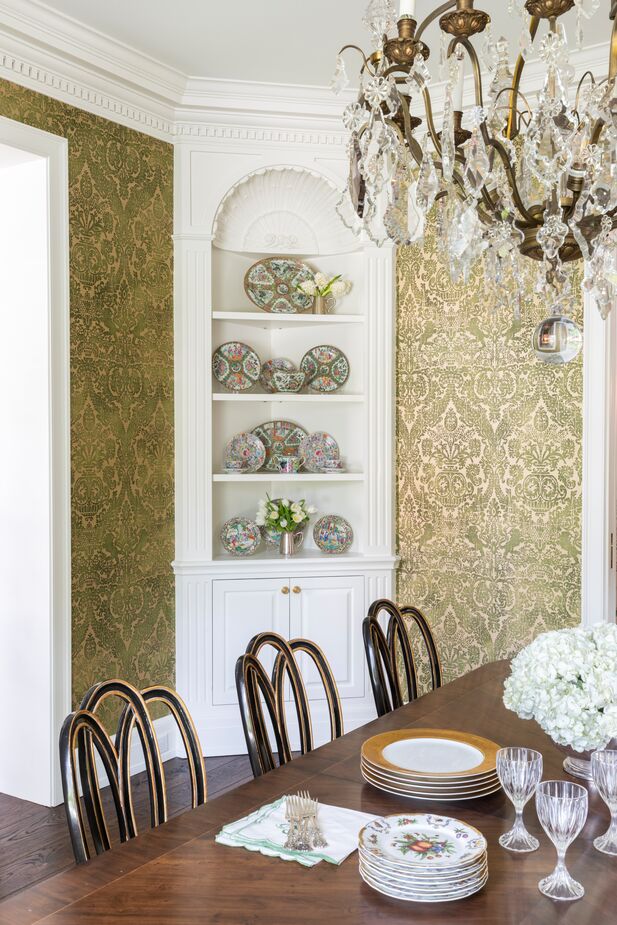 Chandos and architect Ryan Gordon designed the dining room built-ins. “The client had a gorgeous collection of Rose Medallion porcelain, and this was the perfect way to display it,” she says.
